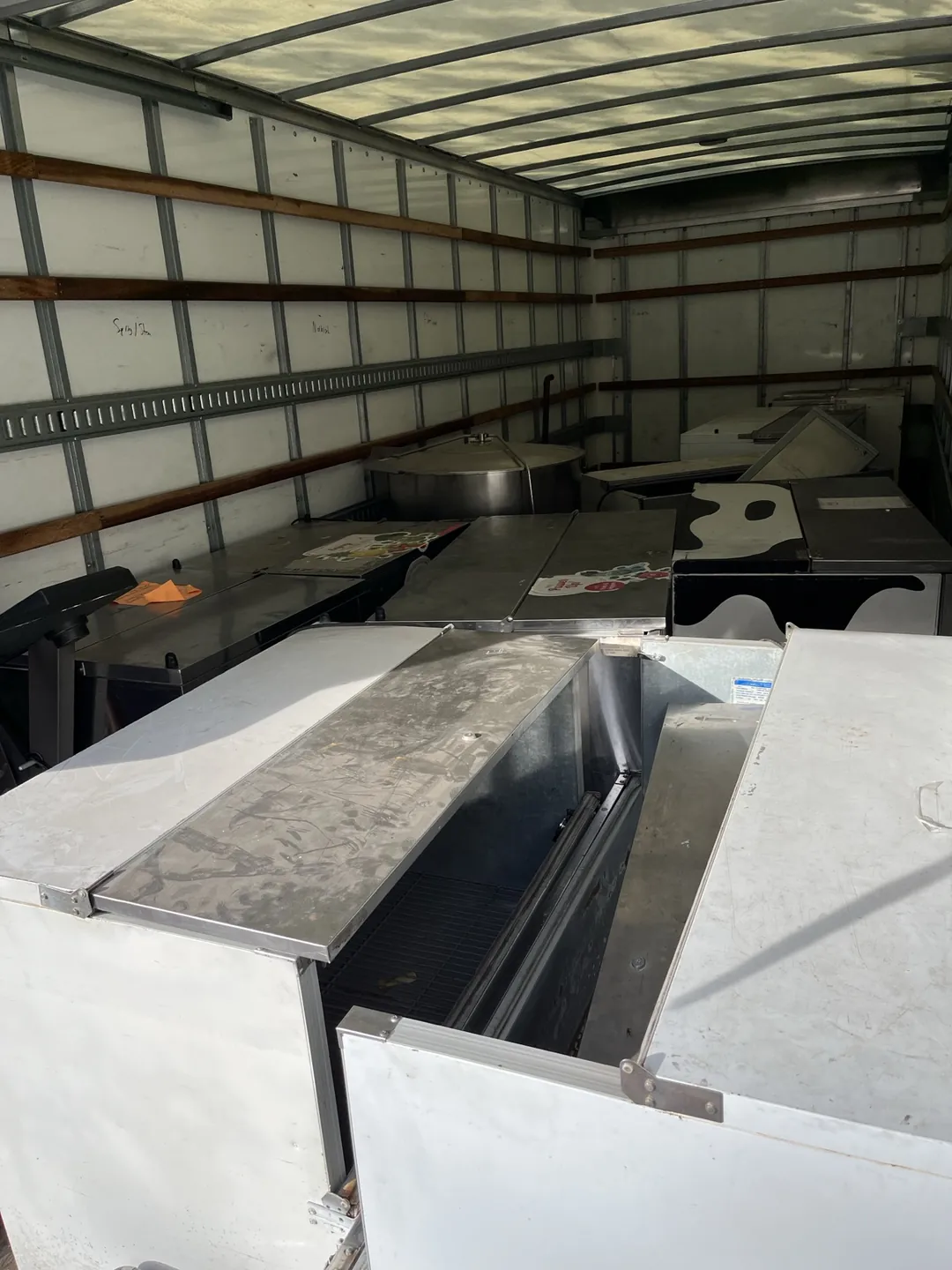 A mix of ferrous and non-ferrous scrap -- steel appliances and assorted metal items loaded in the Indy Pickup 1111 truck